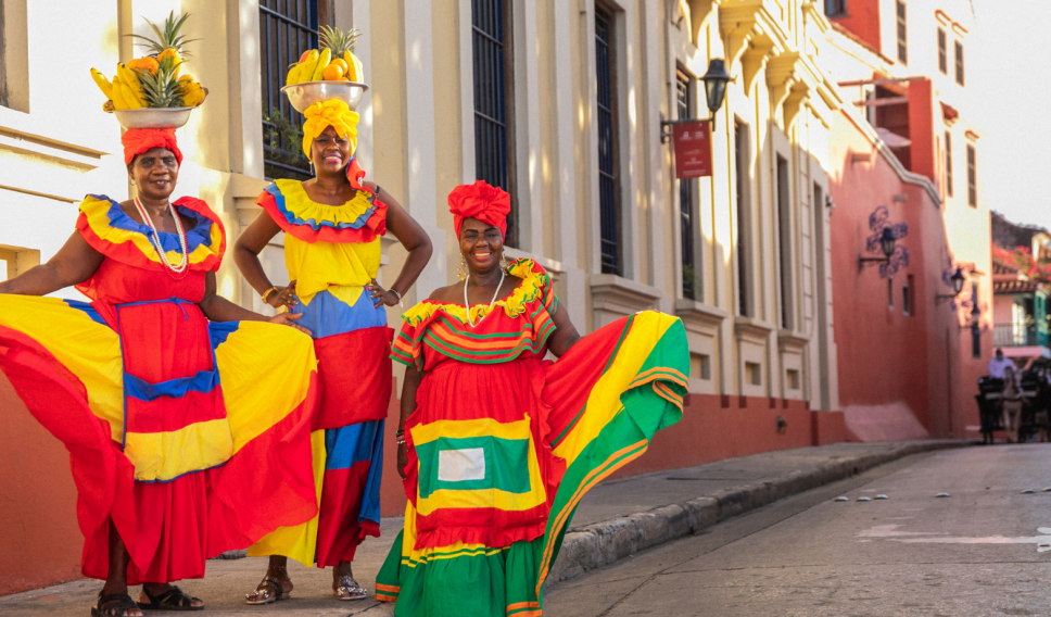 Columbian women dressed in colorful dresses