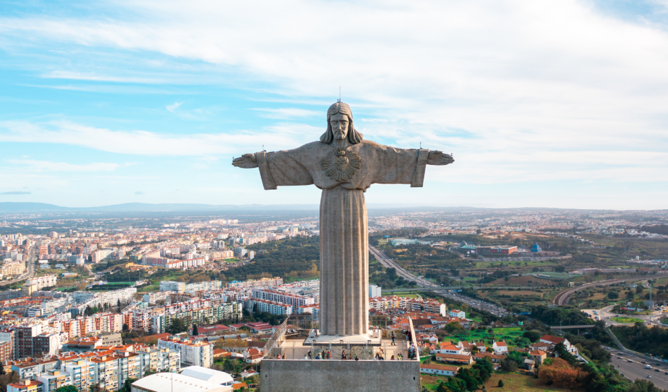 Christ the King monument overlooking Lisbon on sunny day