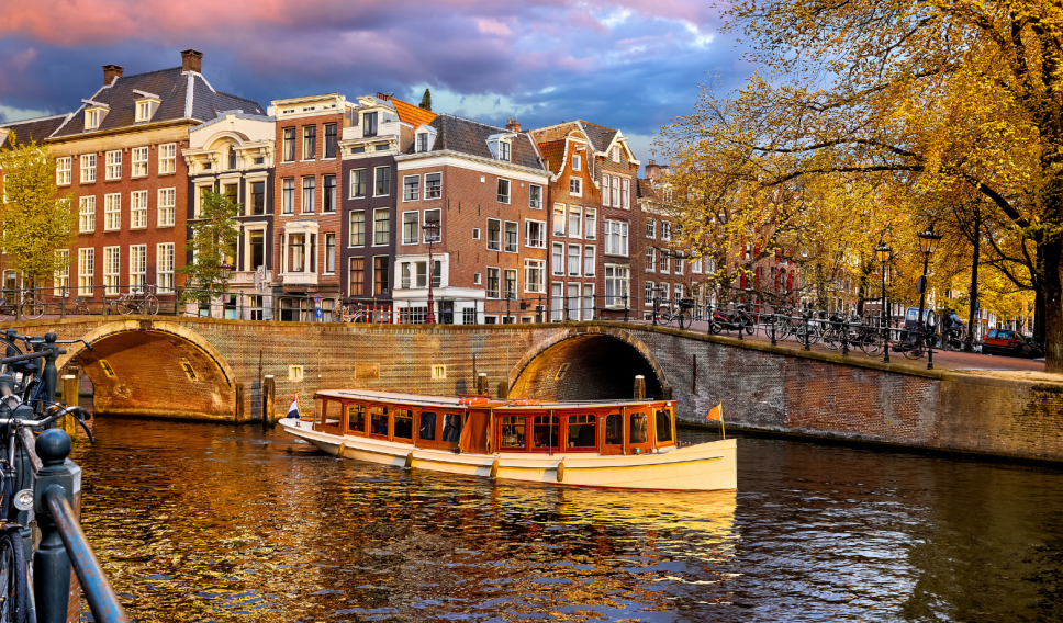 Amsterdam Canal View with Bicycles in Autumn / yasonya